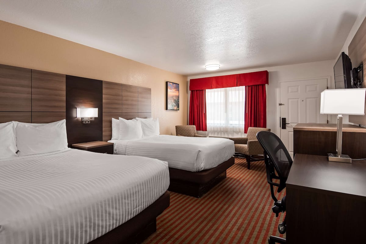 Premium bedding, pillow-top beds, desk, laptop workspace