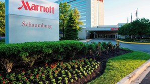 A Marriott hotel with a large sign, well-maintained landscaping, and a modern building facade. - Marriott Chicago Schaumburg (Schaumburg)