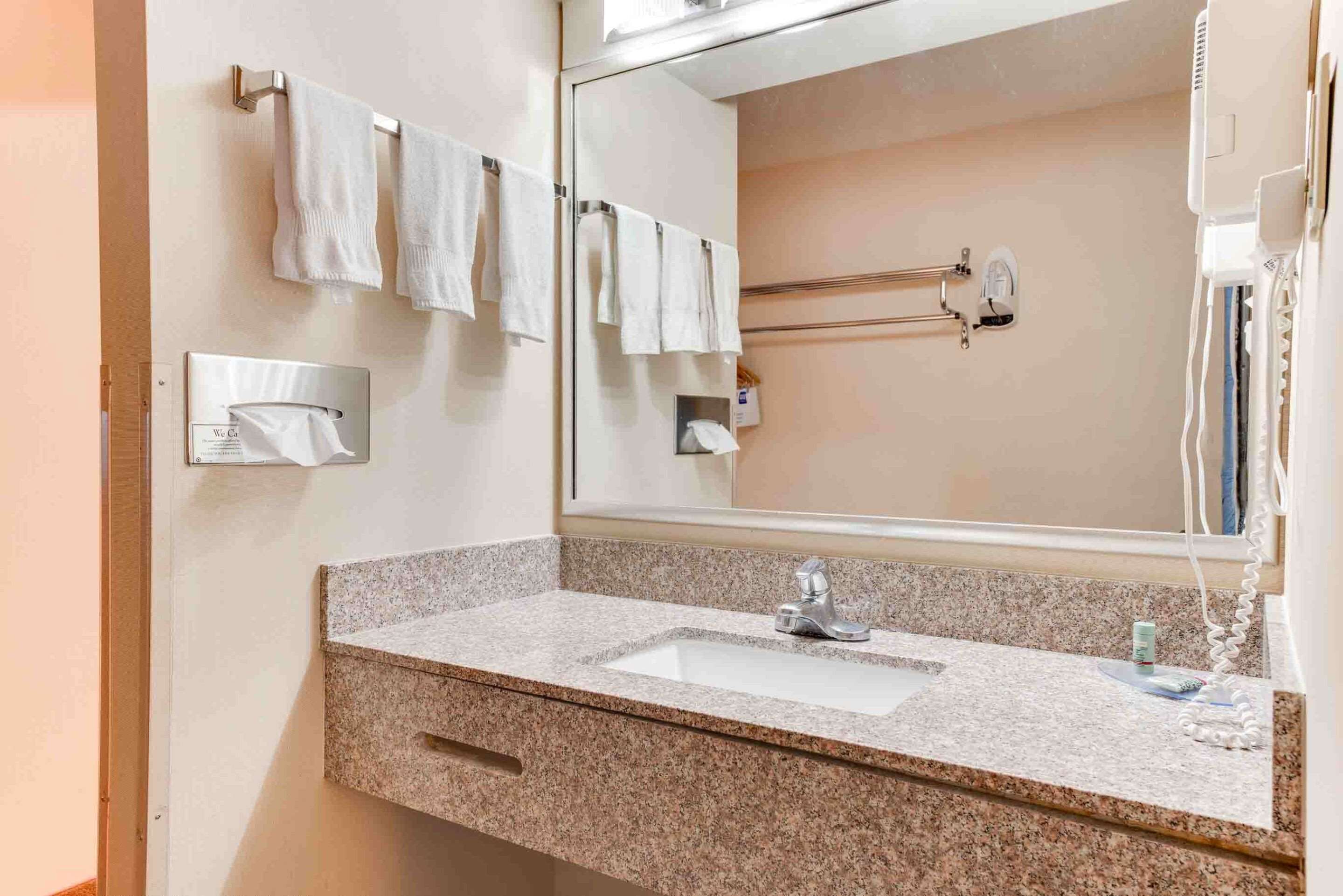 standard room, 2 queen beds, non smoking, refrigerator & microwave (movie view) | bathroom | free toiletries, hair dryer, towels