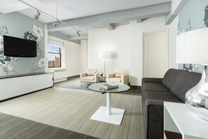 One bedroom Suite -2 double beds | Living room | 40-inch Smart TV with cable channels, TV, pay movies - Stewart Hotel (New York)