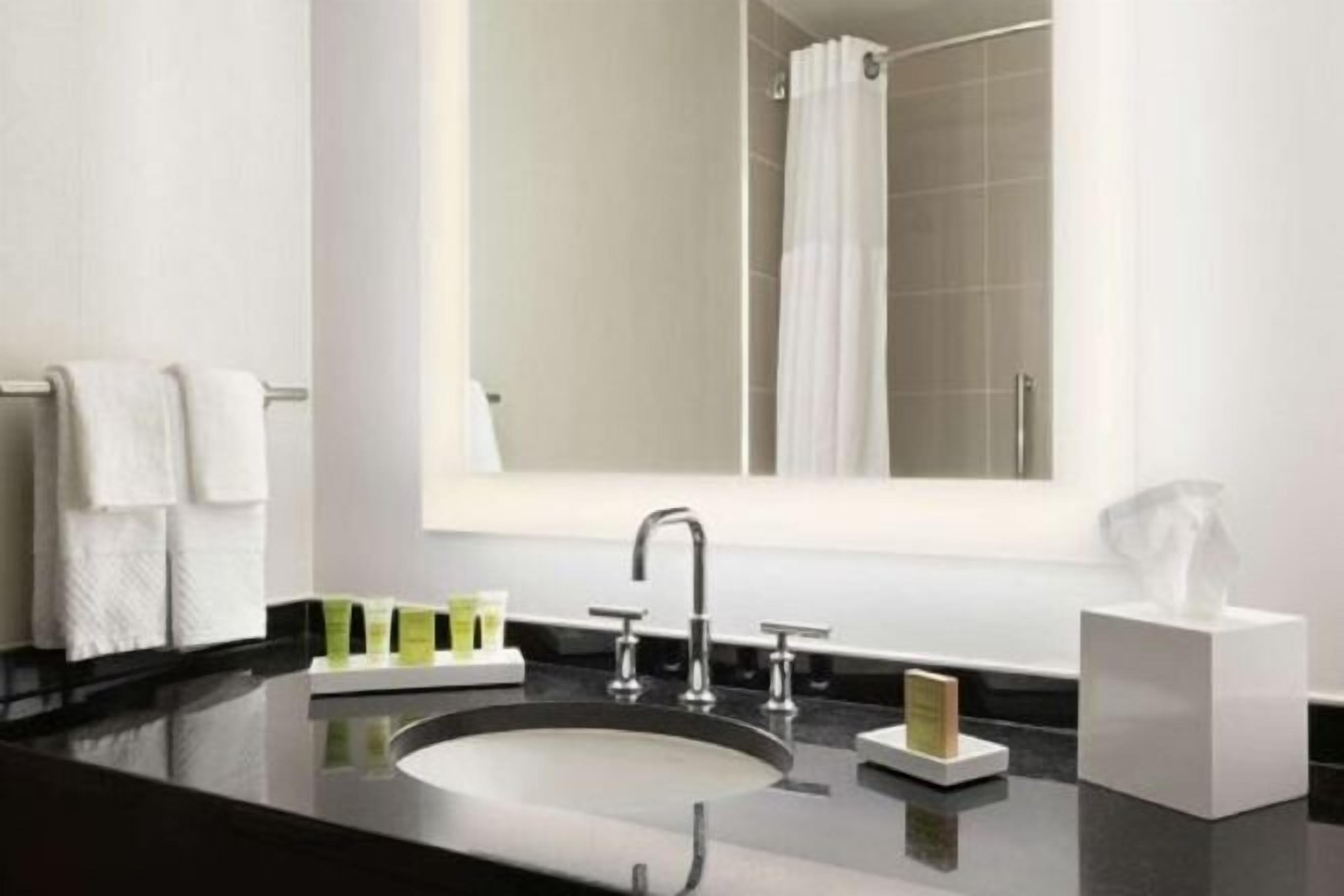 Combined shower/tub, designer toiletries, hair dryer, towels