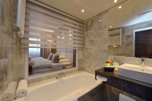 Suite, 1 Double Bed (Separate Living Room) | Bathroom | Shower, free toiletries, hair dryer, towels
