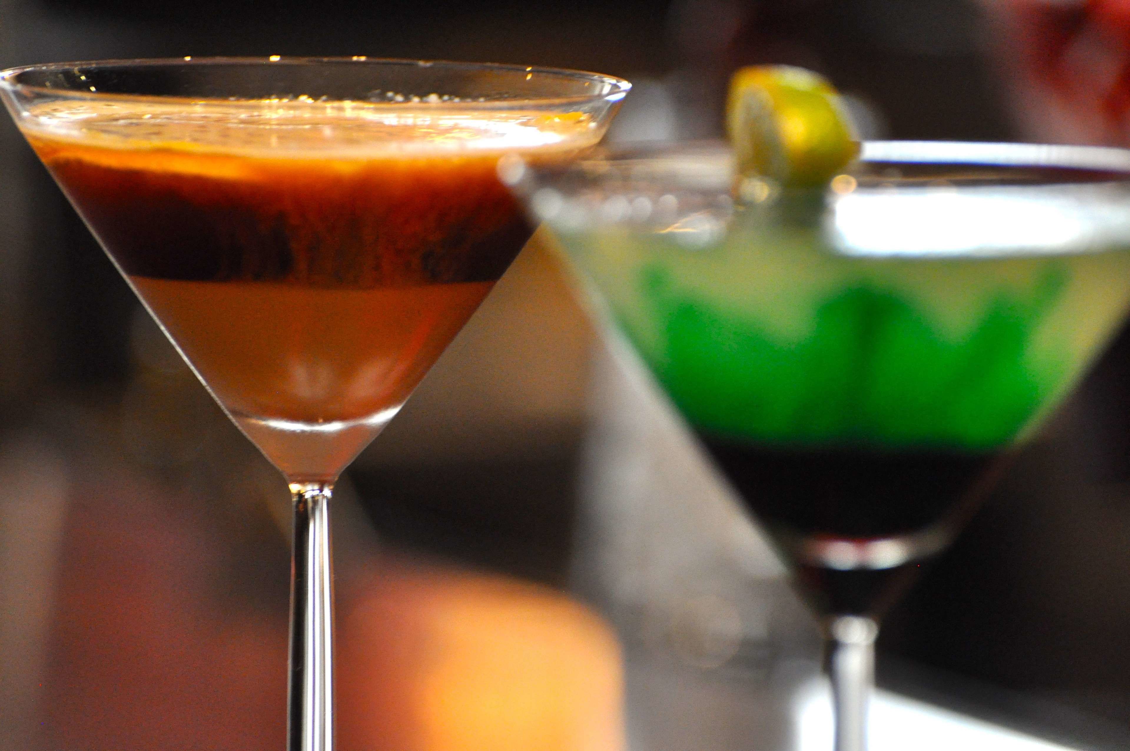 Two cocktails in martini glasses.