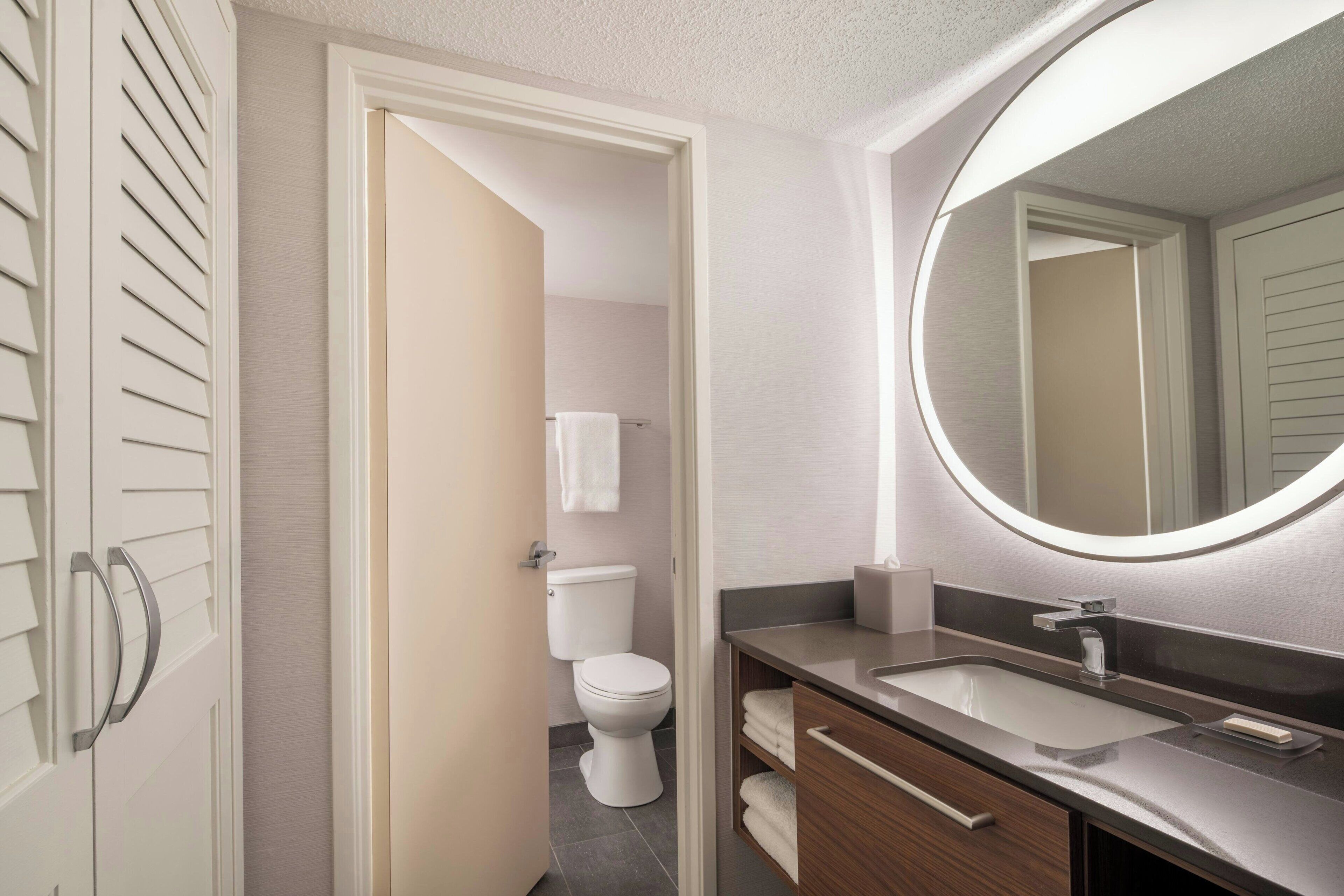 deluxe room, 2 queen beds, non smoking | bathroom | eco-friendly toiletries, hair dryer, towels