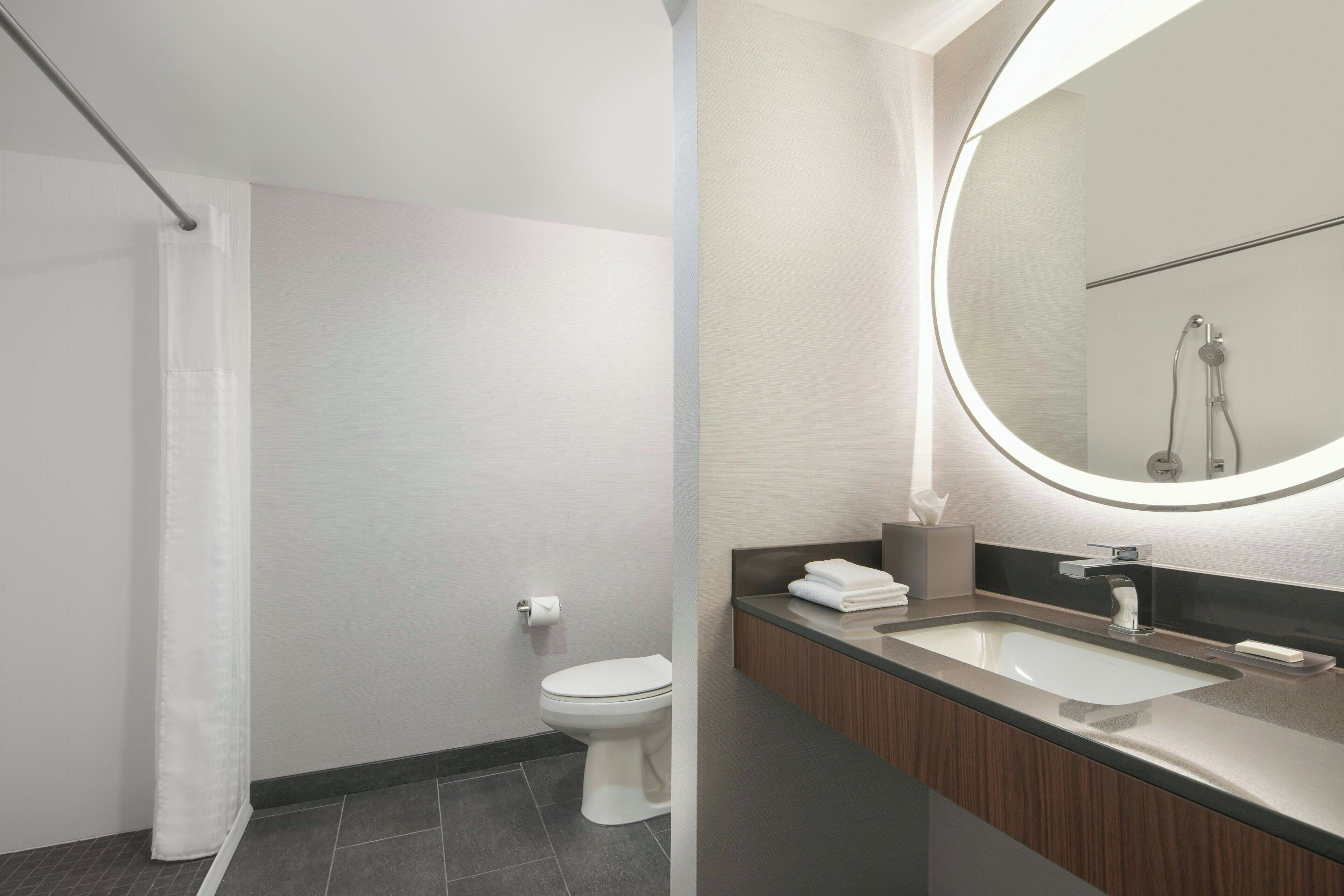 deluxe room, 2 queen beds, non smoking | bathroom | eco-friendly toiletries, hair dryer, towels