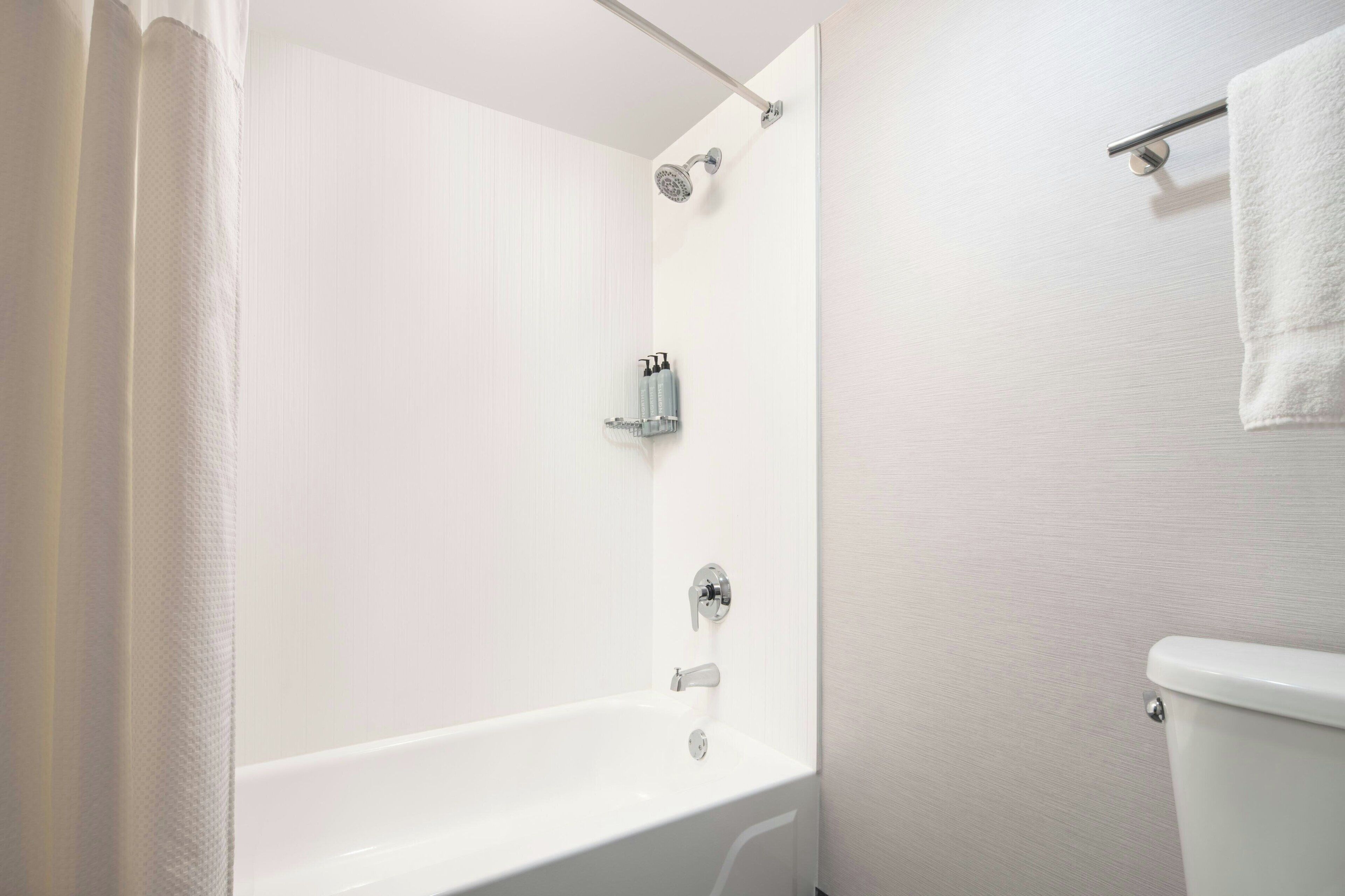 deluxe room, 2 queen beds, non smoking | bathroom | eco-friendly toiletries, hair dryer, towels