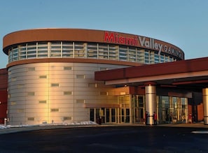 A modern building with a curved facade and the name 'Miami Valley Gaming' prominently displayed.