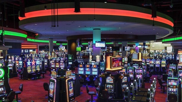 A casino with multiple gaming machines and a curved ceiling structure. - Fairfield Inn Middletown Monroe (Middletown)