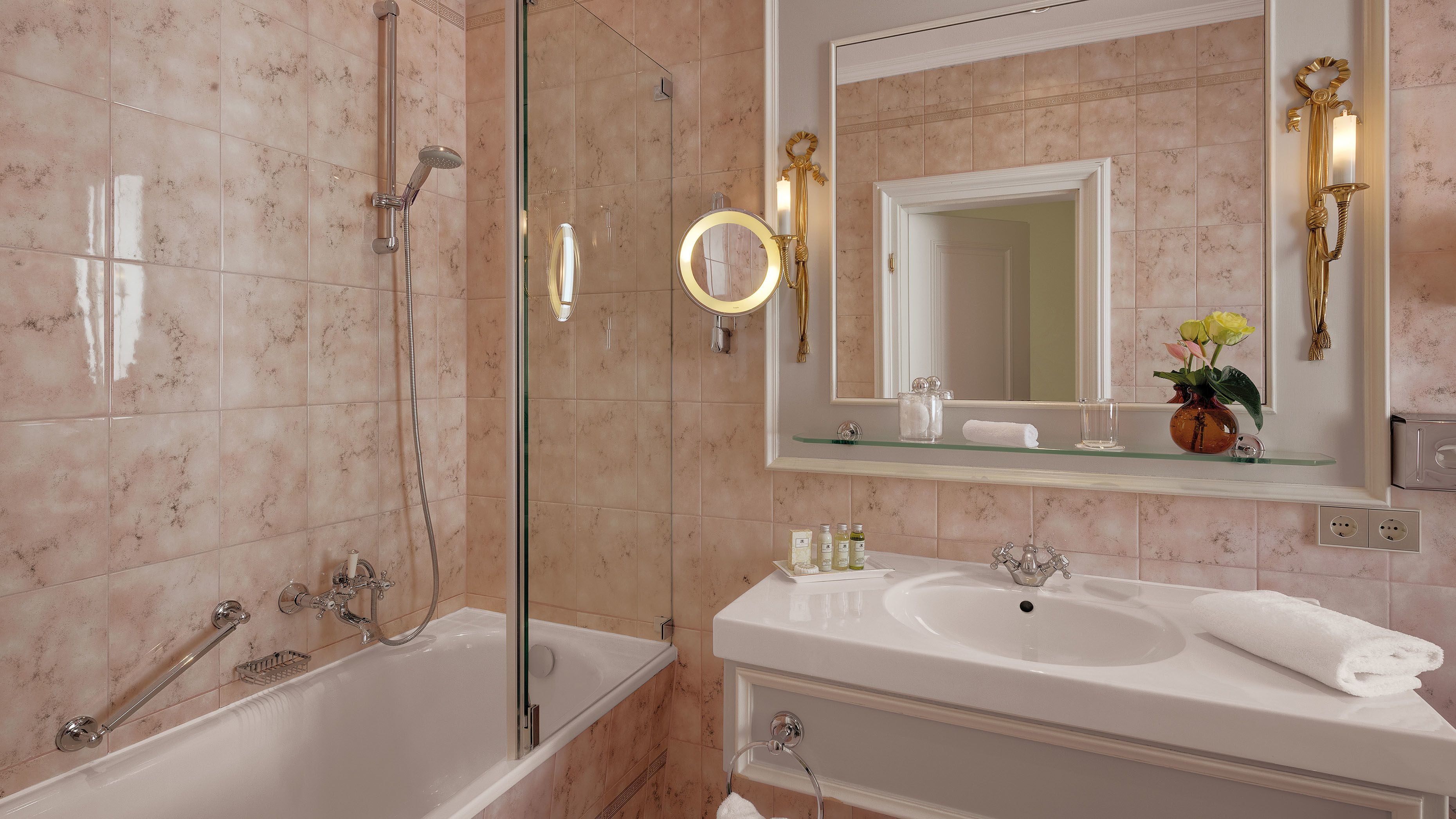 designer toiletries, hair dryer, bathrobes, slippers