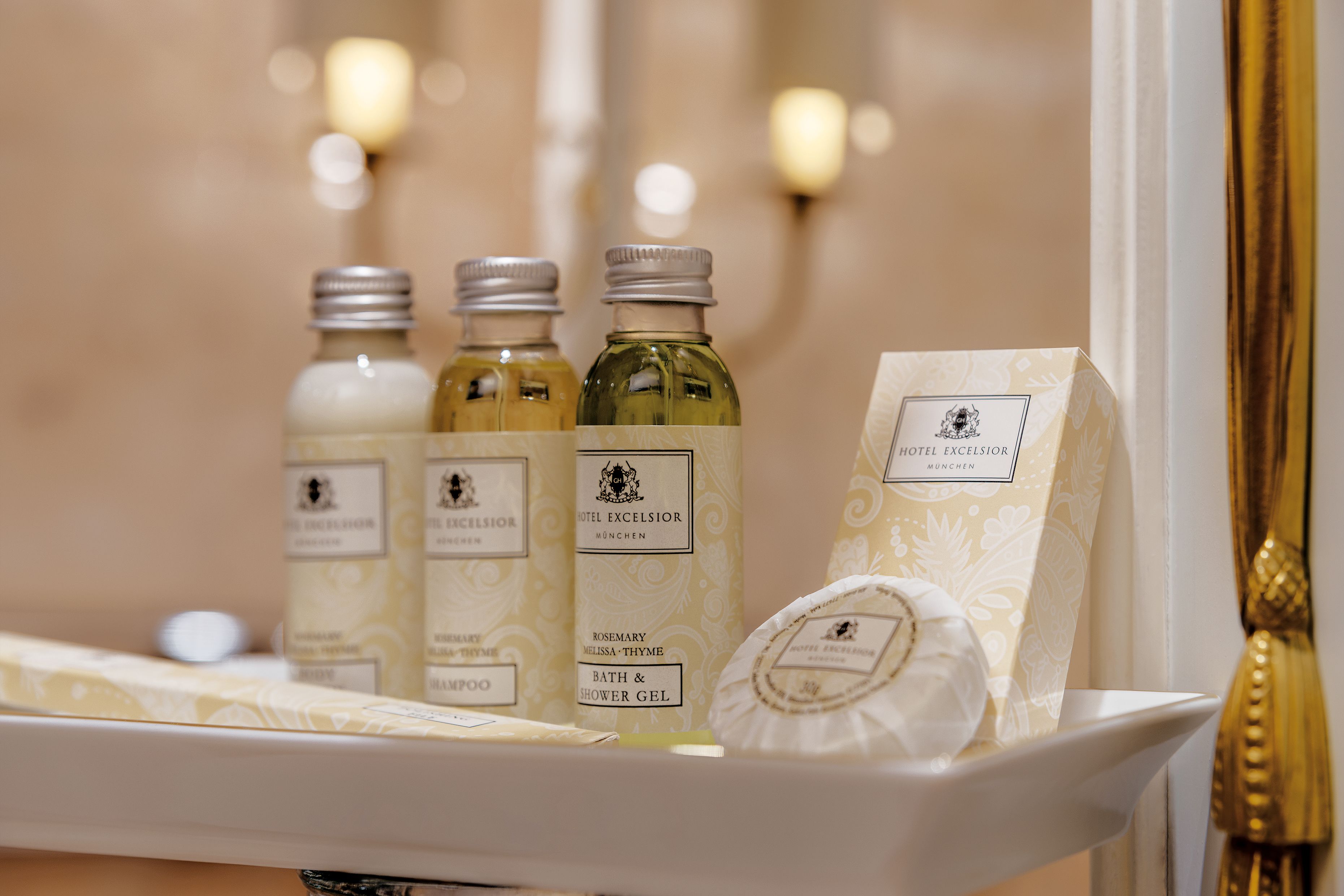 designer toiletries, hair dryer, bathrobes, slippers