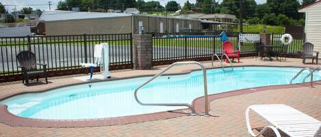 Seasonal outdoor pool, open noon to 7:00 PM, pool umbrellas