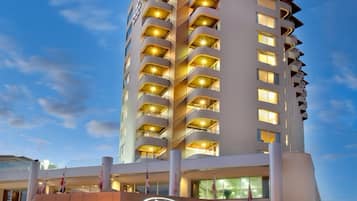 Experience the sleek, modern design of Crowne Plaza, where a grand entrance welcomes you to a stylish stay.