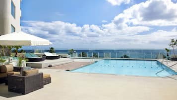 Outdoor pool, open 9:00 AM to 9:00 PM, pool umbrellas, pool loungers