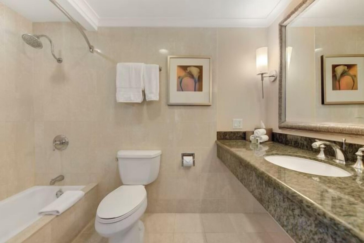 Designer toiletries, hair dryer, bathrobes, slippers
