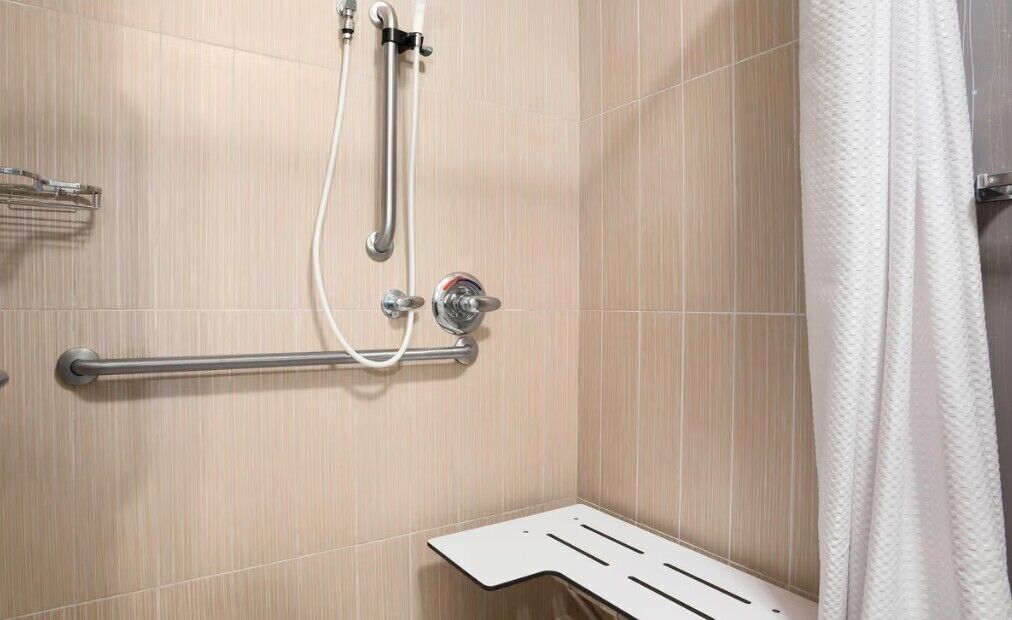 room, 1 king bed (mobility/hearing access, roll-in shwr) | bathroom | combined shower/bathtub, designer toiletries, hair dryer, towels