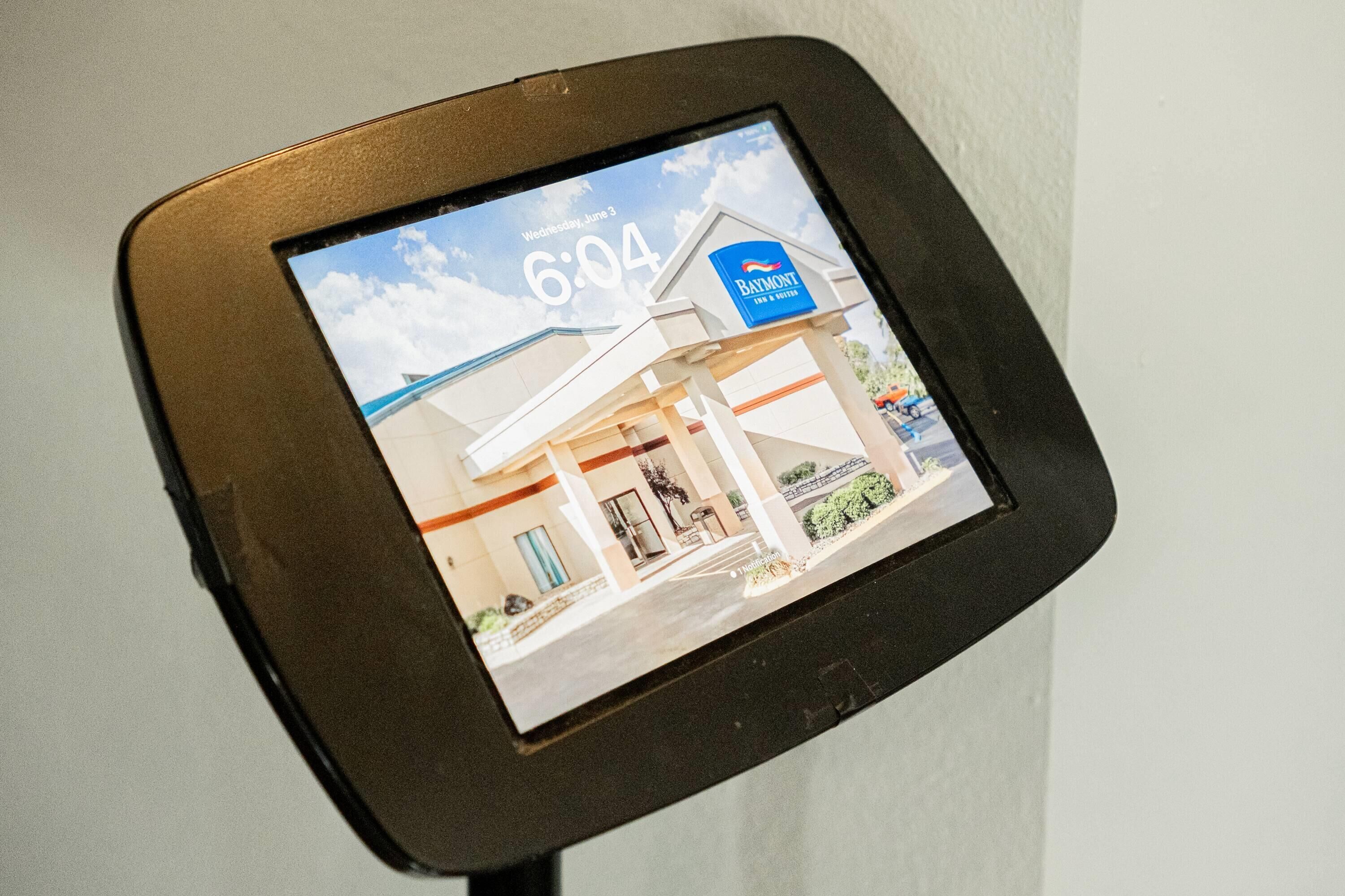 A digital display with a timestamp and a building's exterior.