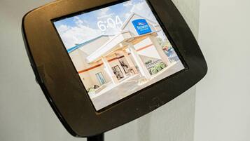 A digital display with a timestamp and a building's exterior.
