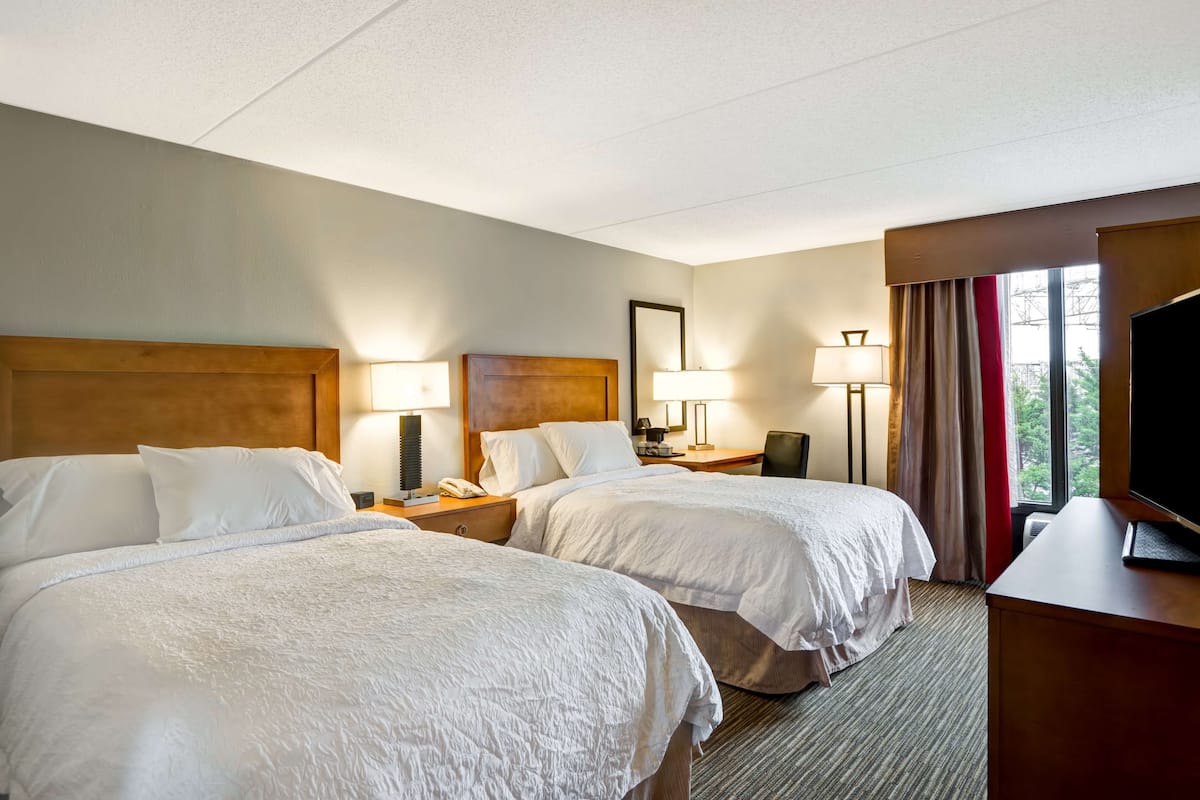 premium bedding, pillow-top beds, desk, blackout curtains