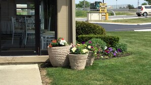 A storefront with a sign reading "The Warehouse" and a signboard advertising UFC fights, cruises, and bike rentals. - Econo Lodge South (Buffalo)
