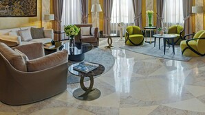 A luxurious lobby with a grand ceiling, elegant furniture, and large windows. - The Westin Excelsior, Rome (Rome)