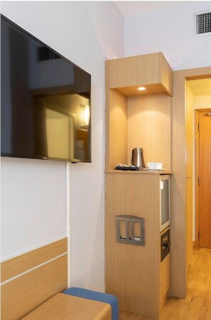Roba de llit d'alta qualitat, minibar i caixa forta a l'habitació 