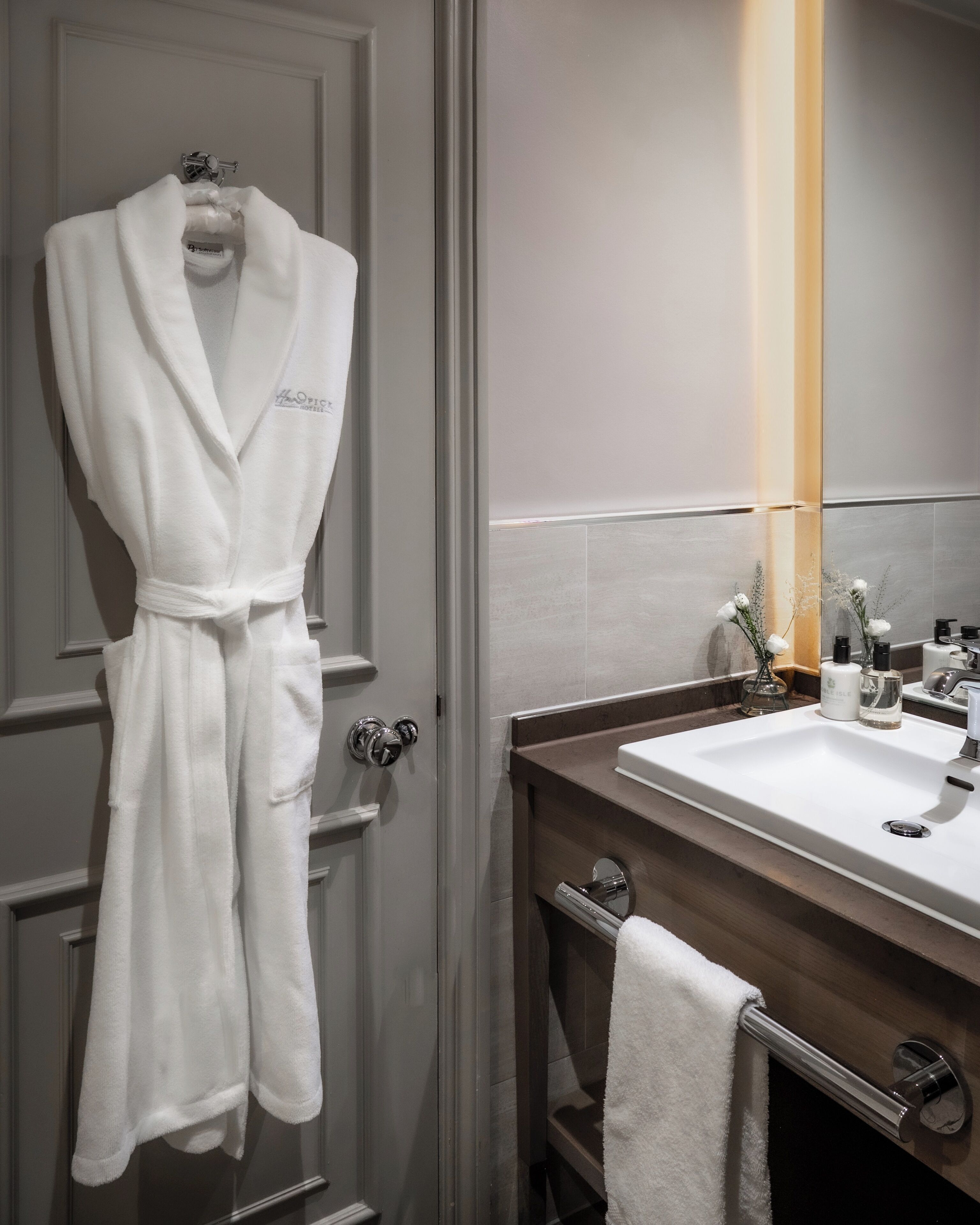 designer toiletries, hair dryer, bathrobes, towels