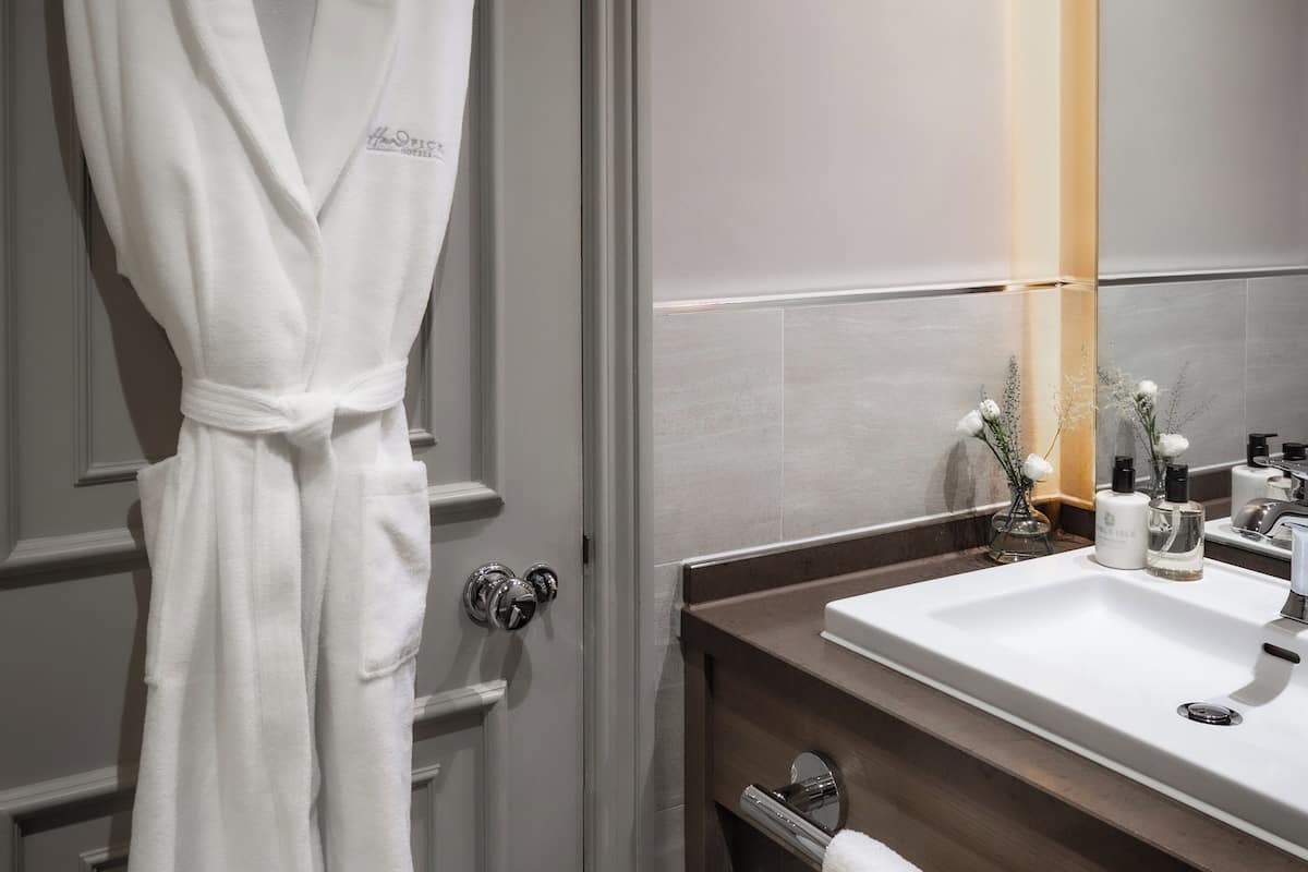 designer toiletries, hair dryer, bathrobes, towels