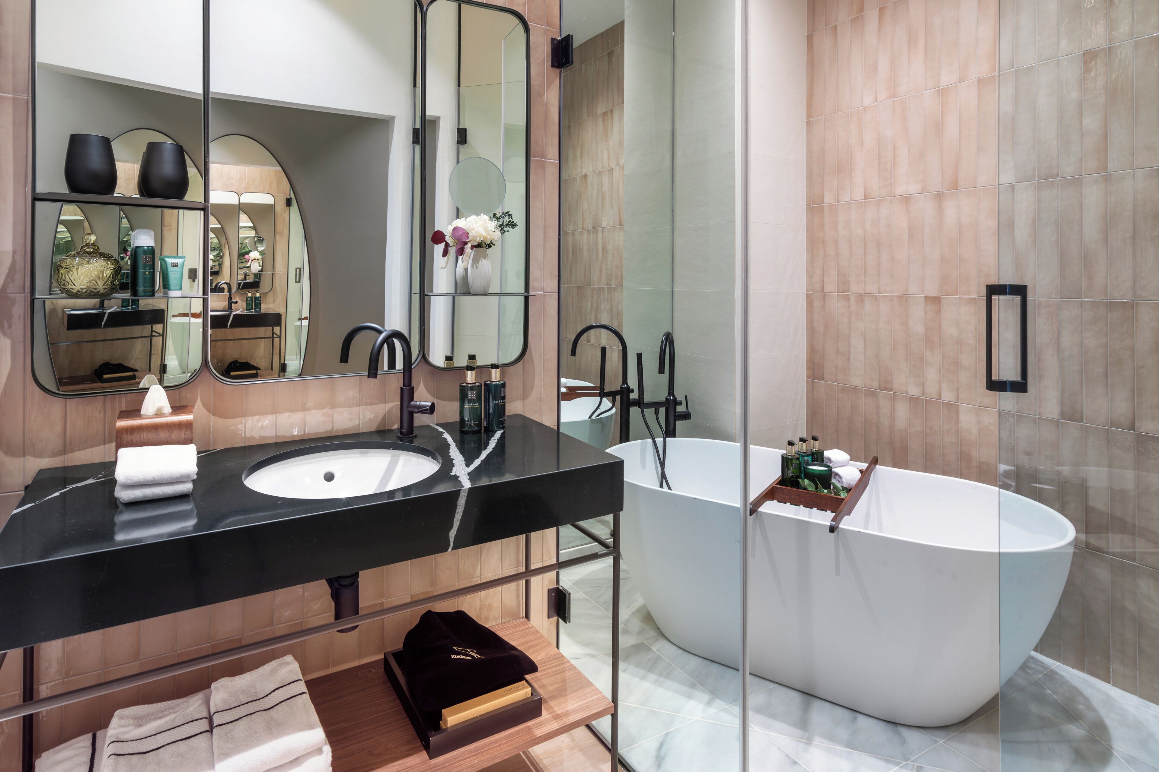 designer toiletries, hair dryer, towels