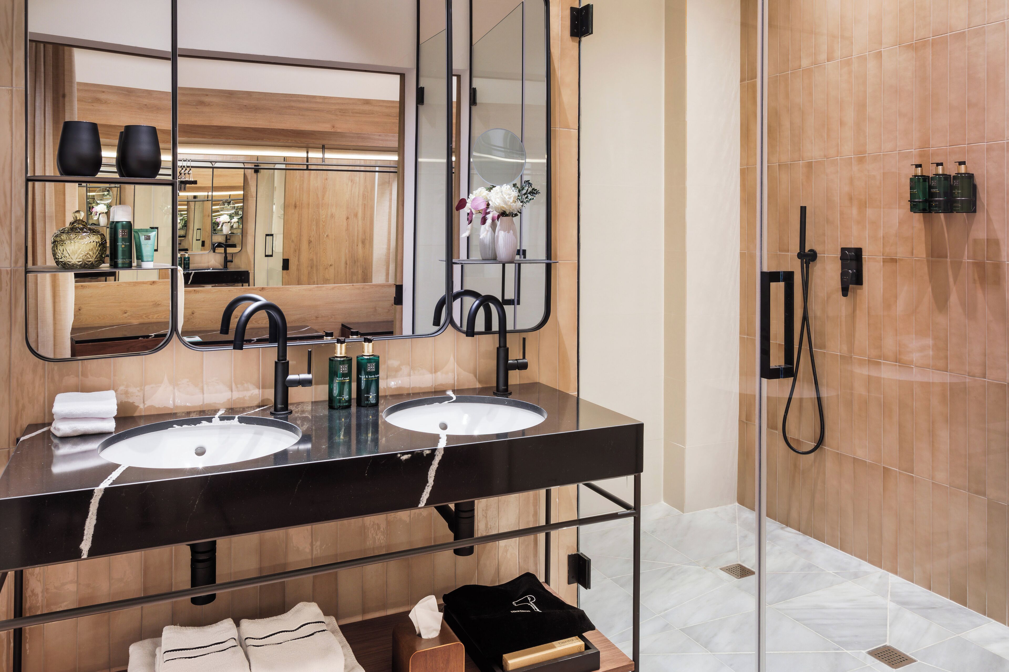 designer toiletries, hair dryer, towels