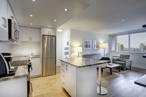 Luxury One Bedroom Suite, 1 King Bed | Living area | Flat-screen TV, pay films - Town Inn Suites Hotel (Toronto)