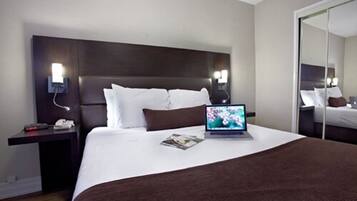 Deluxe One Bedroom Suite | 1 bedroom, premium bedding, blackout drapes, iron/ironing board