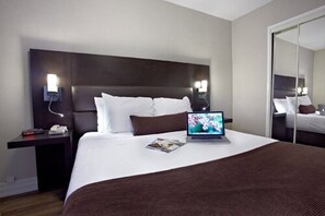 Deluxe One Bedroom Suite | 1 bedroom, premium bedding, blackout curtains, iron/ironing board