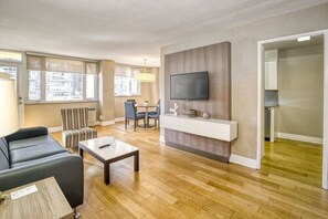 Suite, 2 Bedrooms | Living area | Flat-screen TV, pay movies