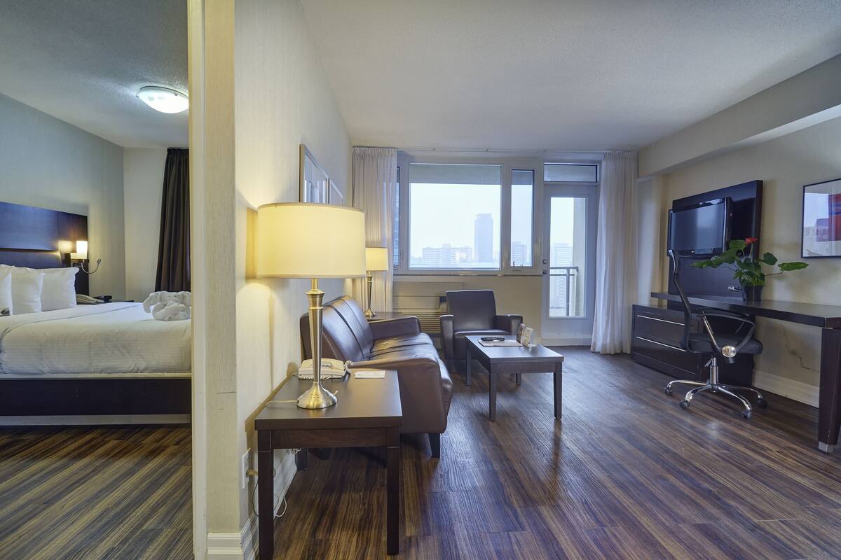 Deluxe One Bedroom Suite | 1 bedroom, premium bedding, blackout drapes, iron/ironing board