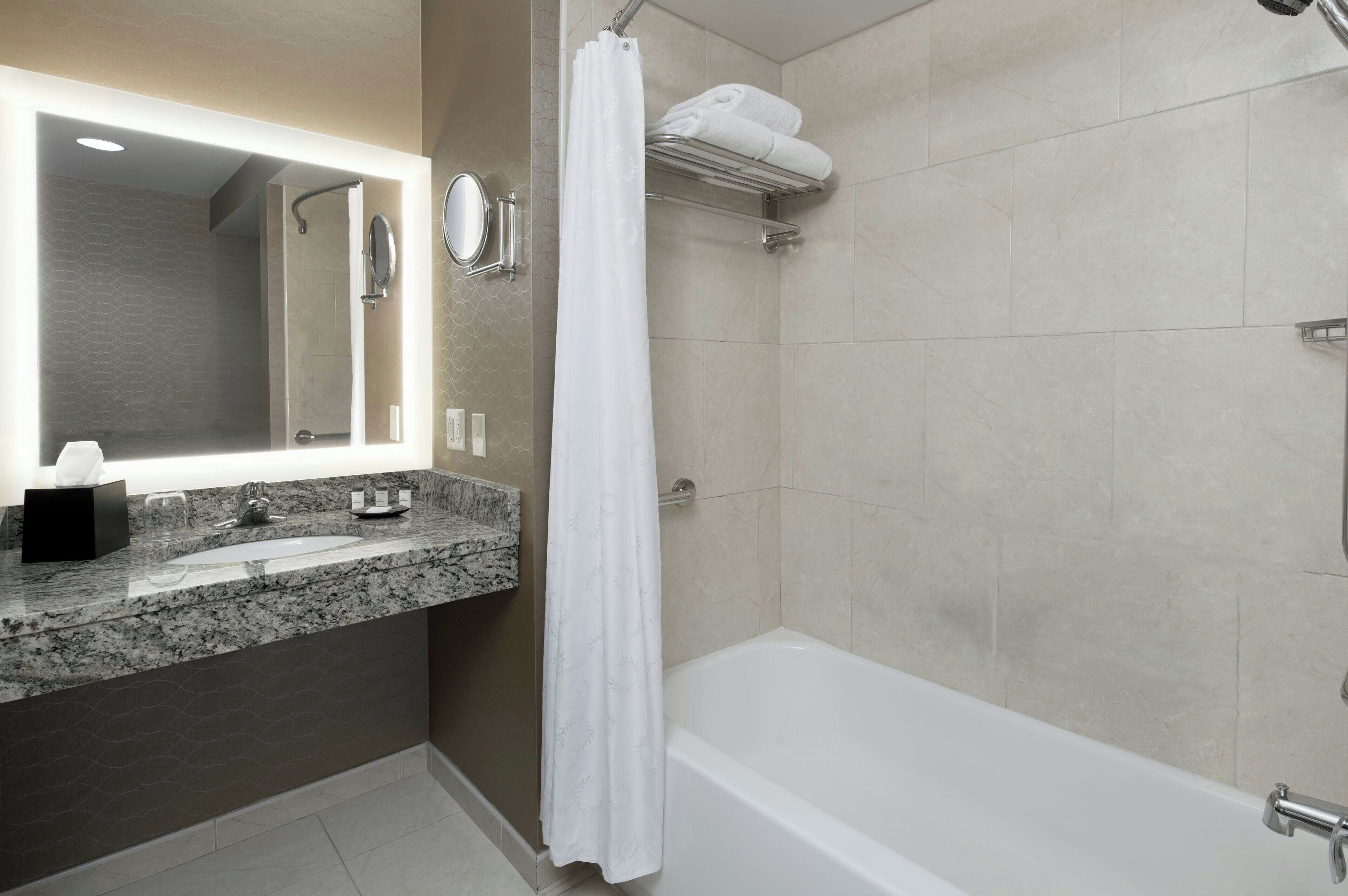 combined shower/bathtub, eco-friendly toiletries, hair dryer, towels