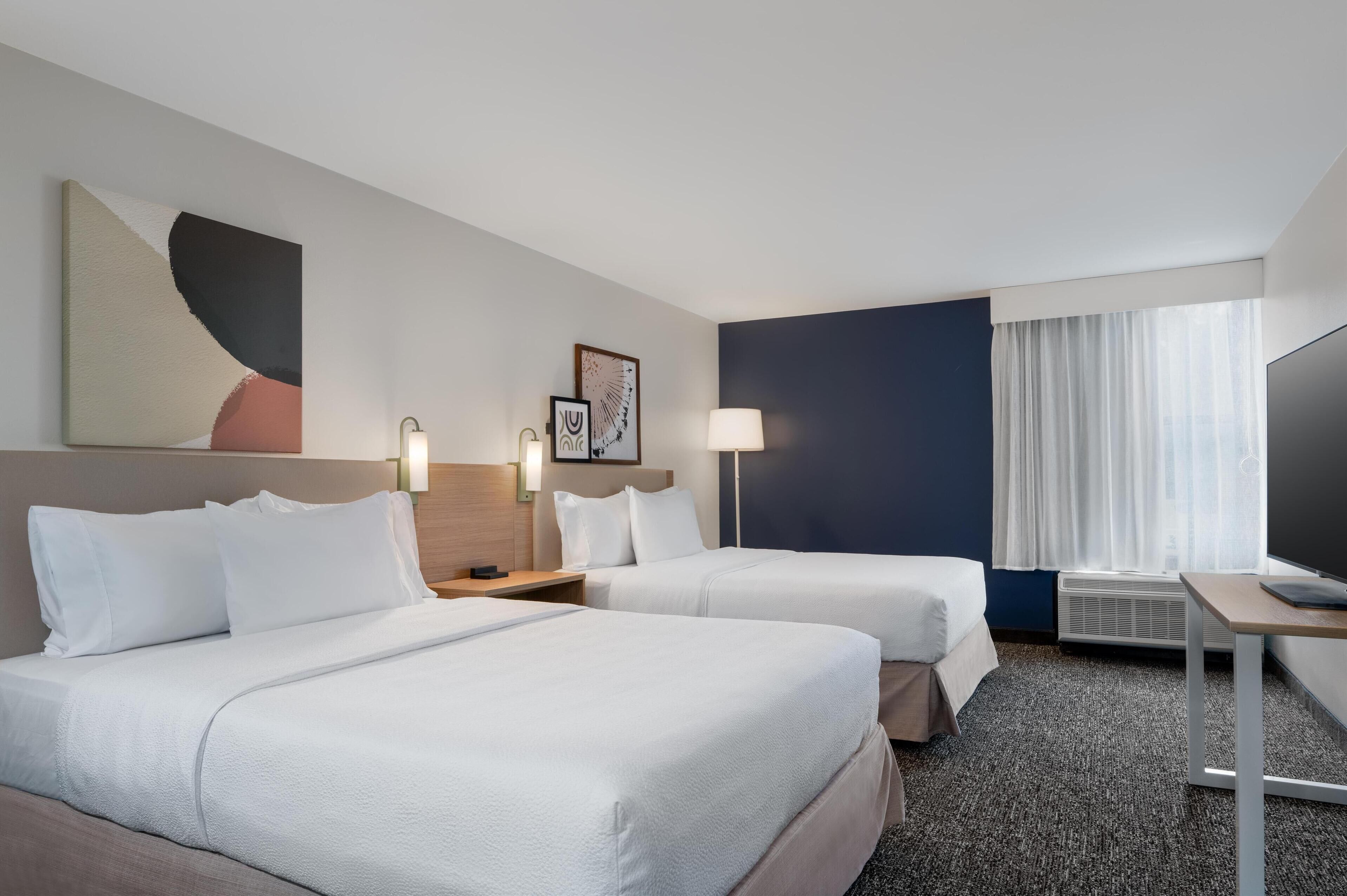 Desk, laptop workspace, blackout drapes, iron/ironing board