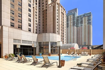 Indoor pool, outdoor pool, open 6 AM to 11 PM, sun loungers at San Antonio Marriott Rivercenter on the River Walk