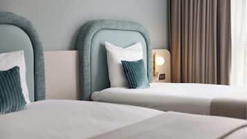 Habitación Deluxe con 2 camas individuales | Ropa de cama de alta calidad, camas con pillow-top y minibar