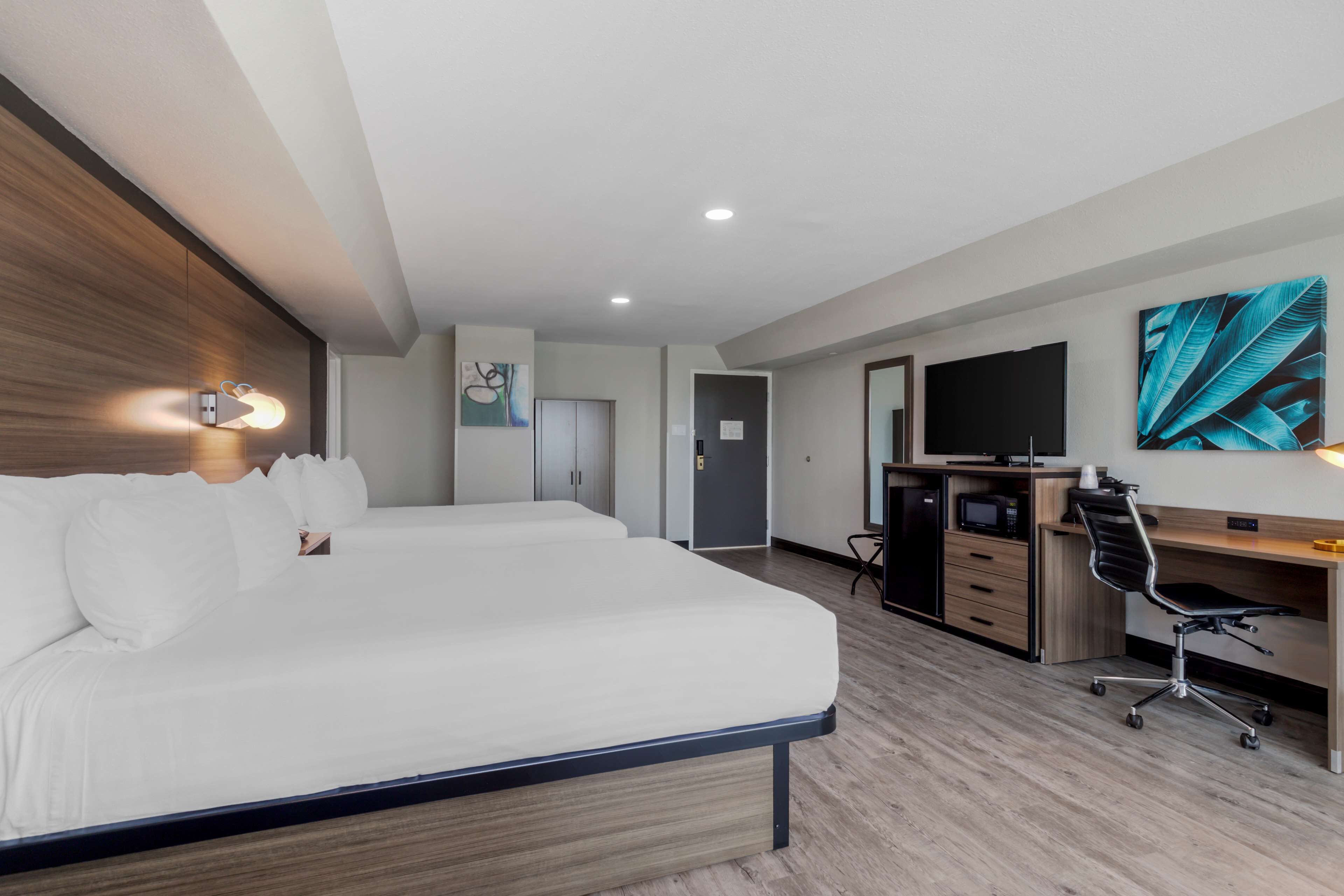 standard room, 2 queen beds, non smoking, refrigerator & microwave (larger room) | down duvets, desk, laptop workspace, blackout curtains