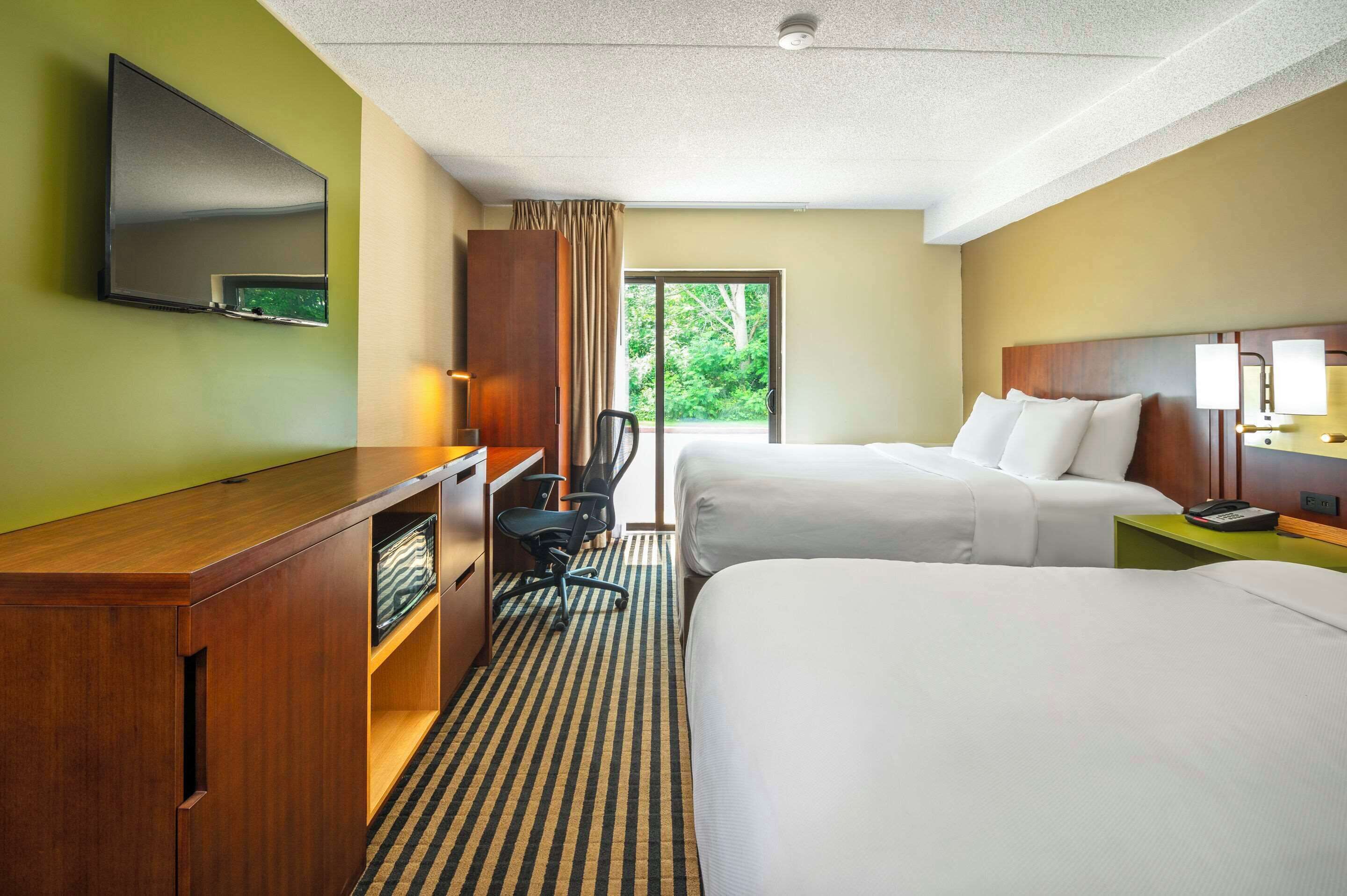 desk, blackout curtains, iron/ironing board, rollaway beds