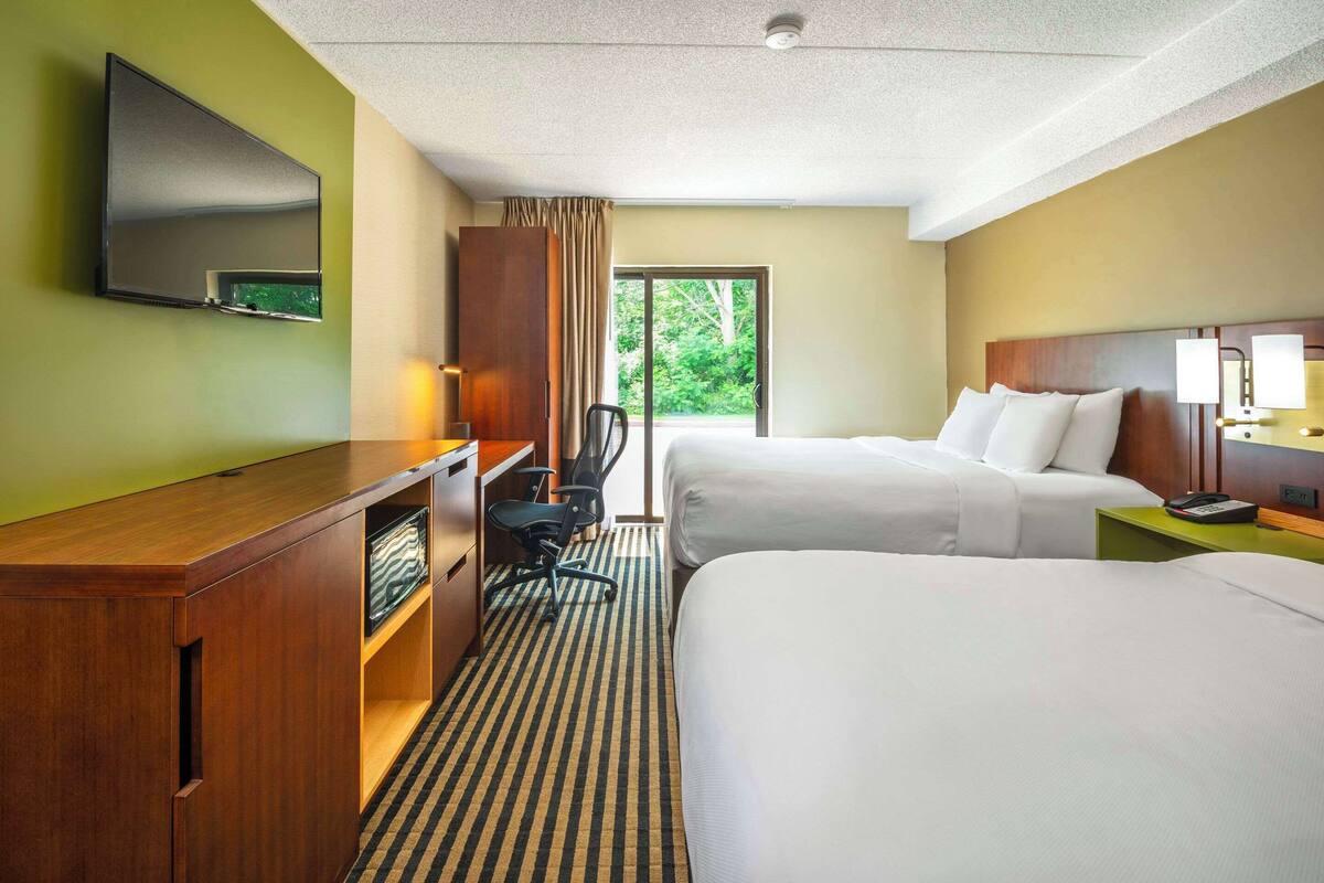 desk, blackout curtains, iron/ironing board, rollaway beds