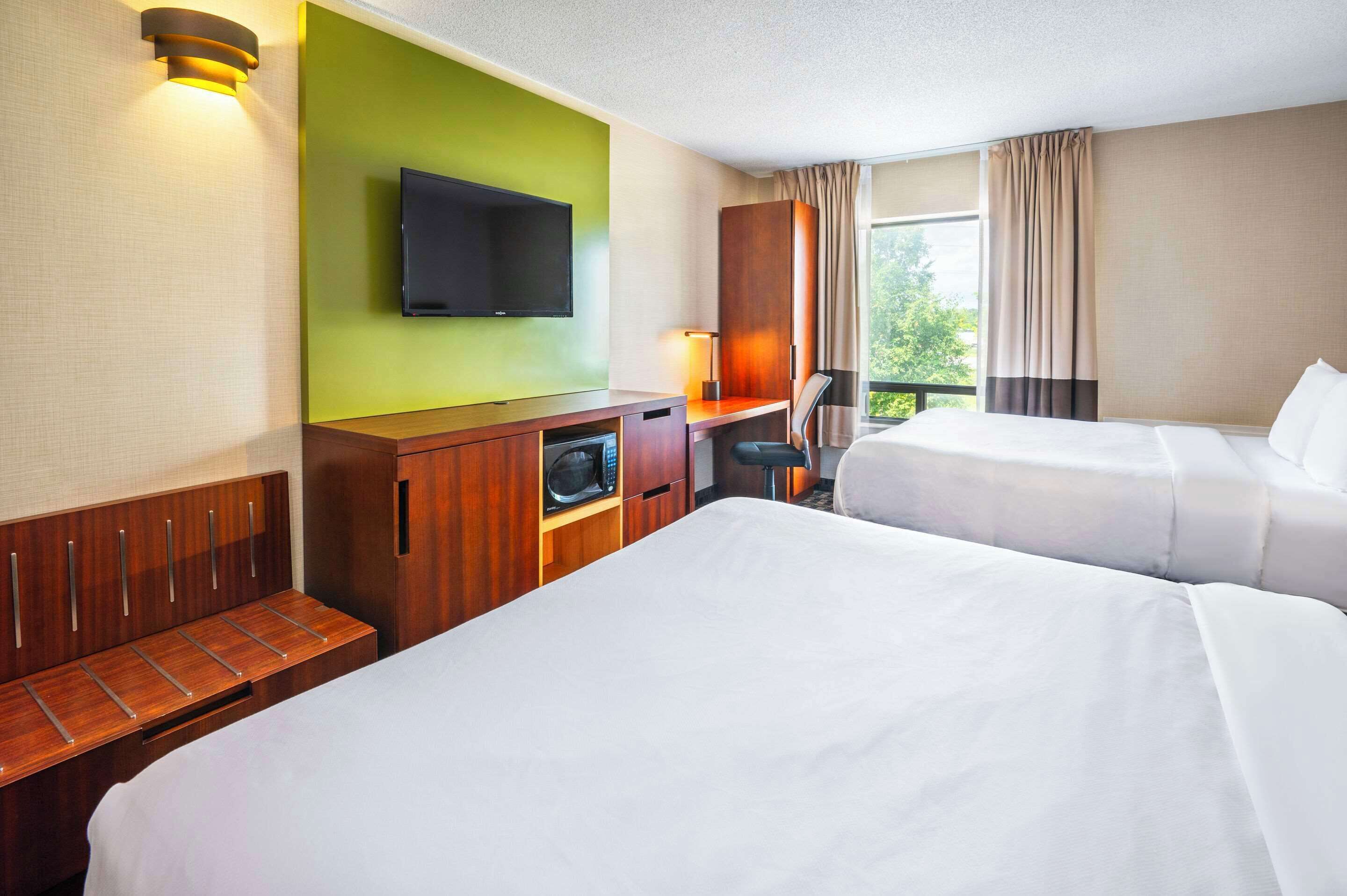 desk, blackout curtains, iron/ironing board, rollaway beds