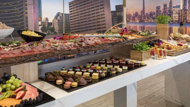 A buffet with various food items and desserts. - Embassy Suites by Hilton Toronto Airport (Toronto)