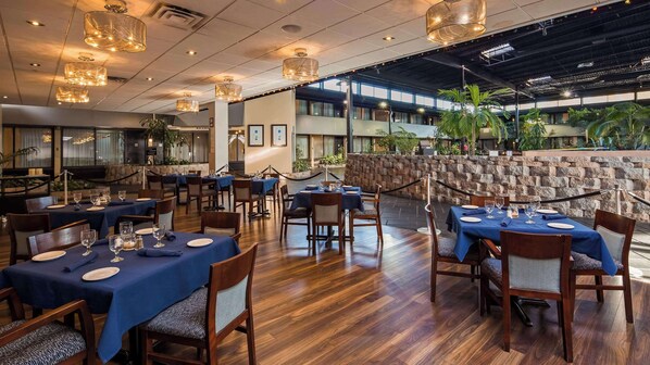 Breakfast, dinner served; local cuisine, pool views 