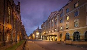 A street lined with historic buildings, a covered walkway, and a clear sky. - Hilton Cambridge City Centre (Cambridge)