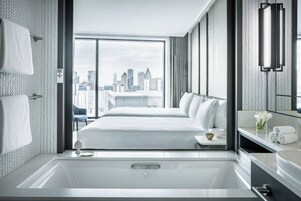 Designer toiletries, hair dryer, bathrobes, slippers