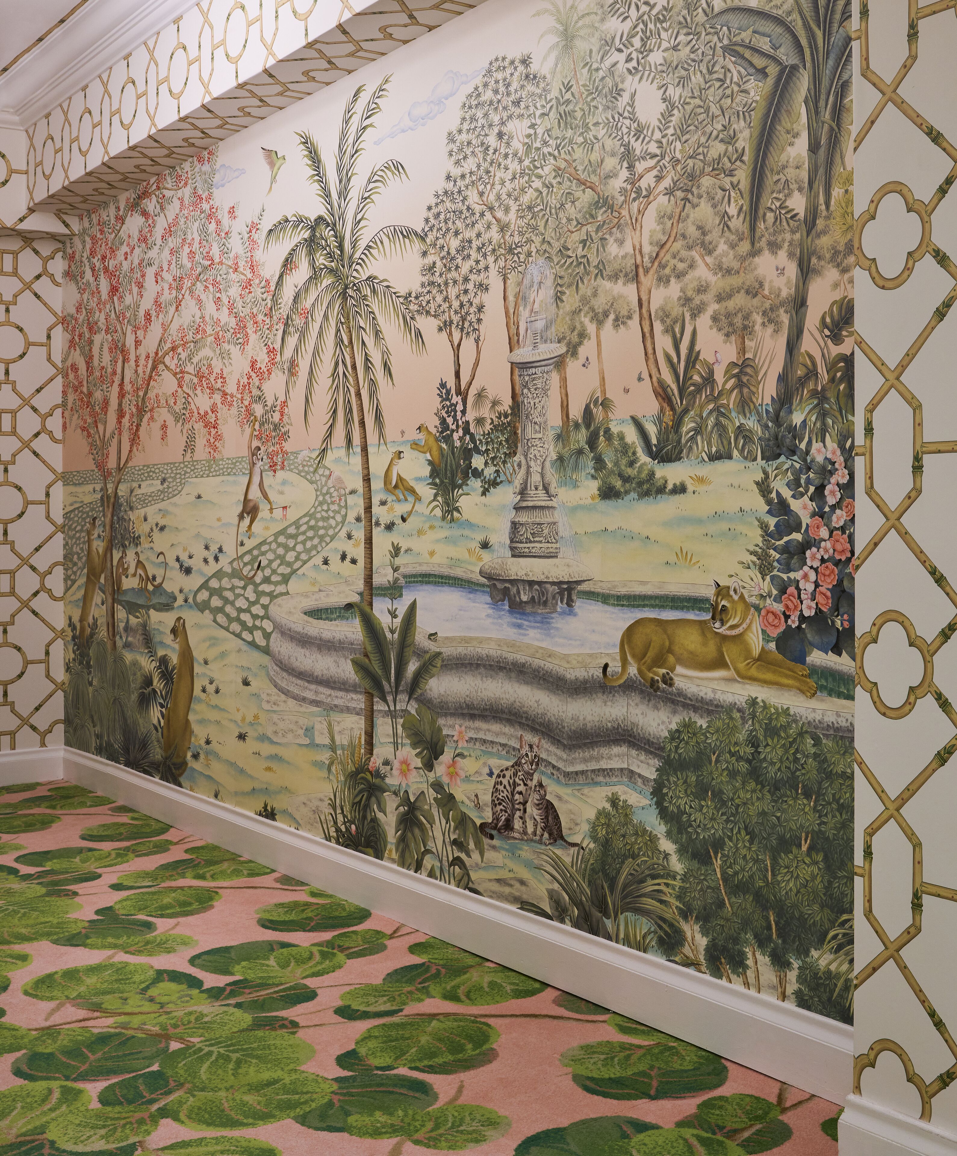 A mural with a jungle theme, including a waterfall and various animals.