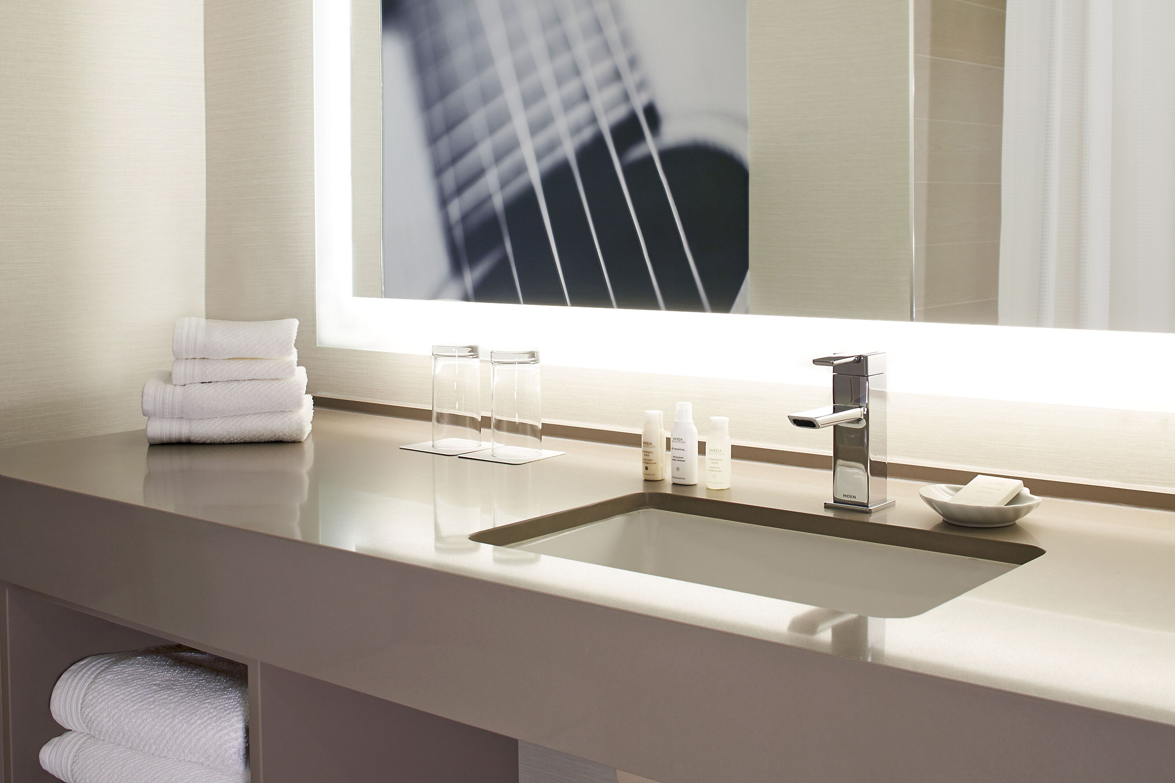 eco-friendly toiletries, hair dryer, towels