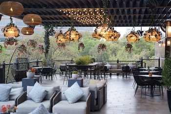 A multi-level hotel atrium with a central open space, multiple balconies, and a variety of seating areas. at Renaissance Austin Arboretum Domain Hotel