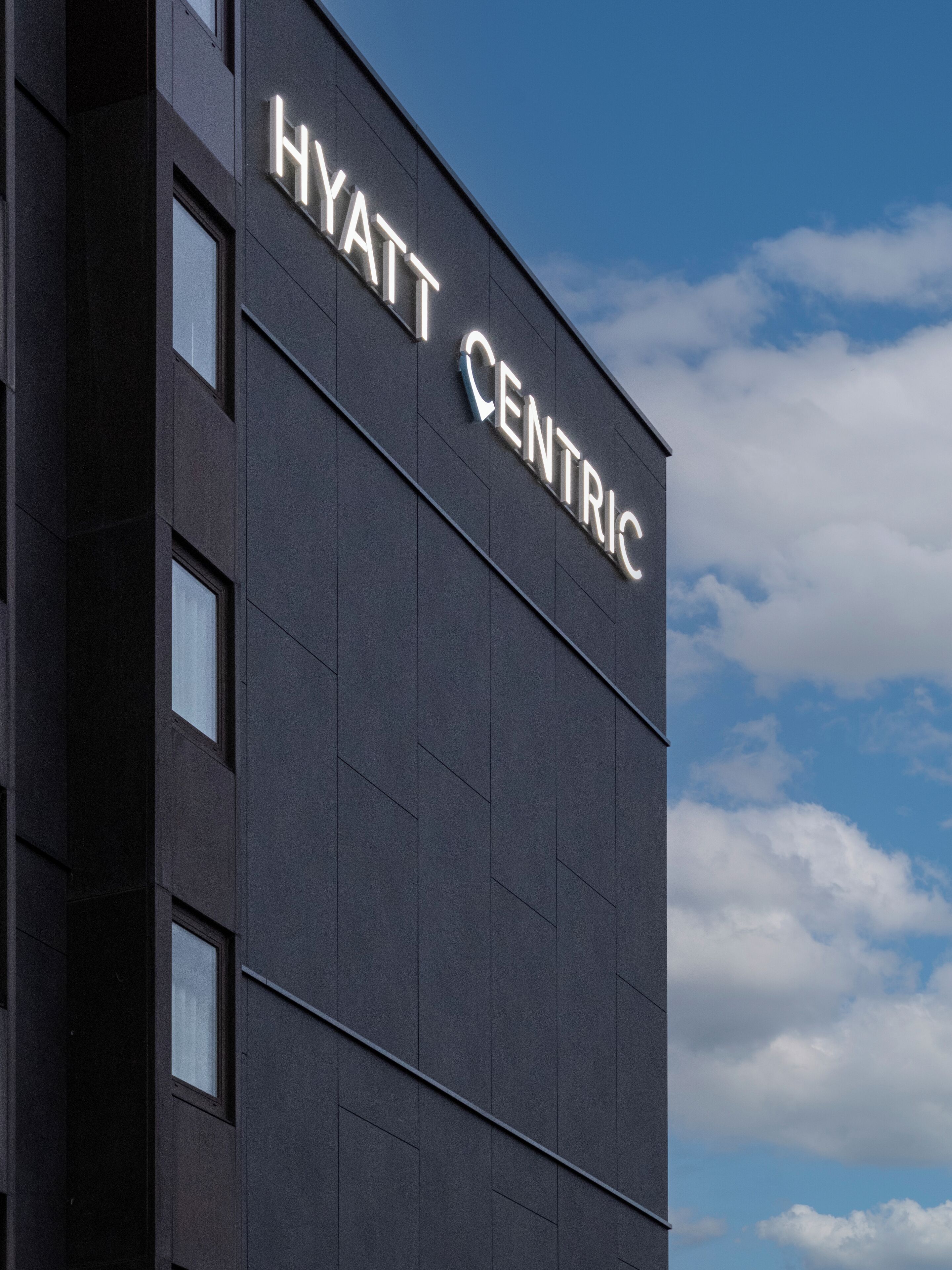A building with the sign "HYATT CENTRIC" indicating a hotel.